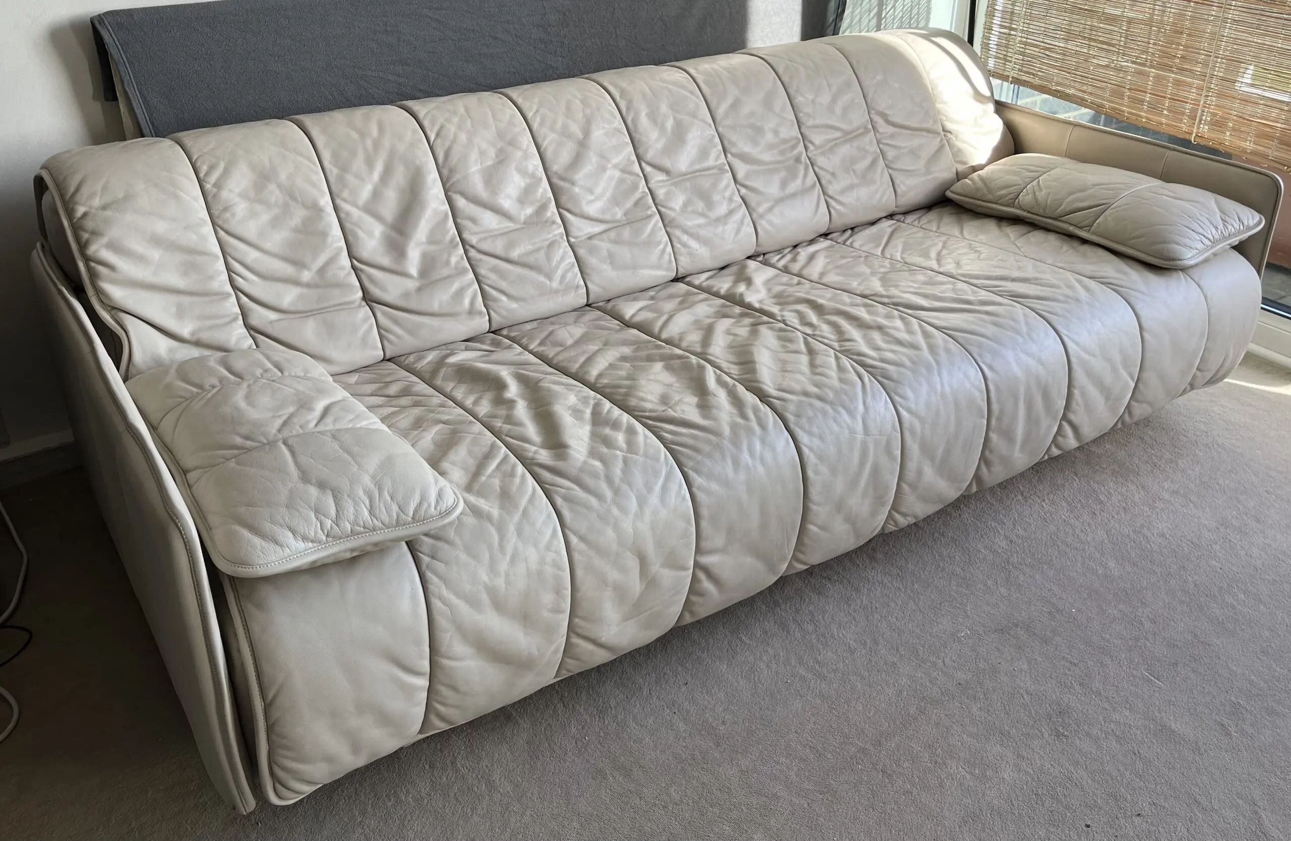 3 seater sofa bed in cream/ivory leather