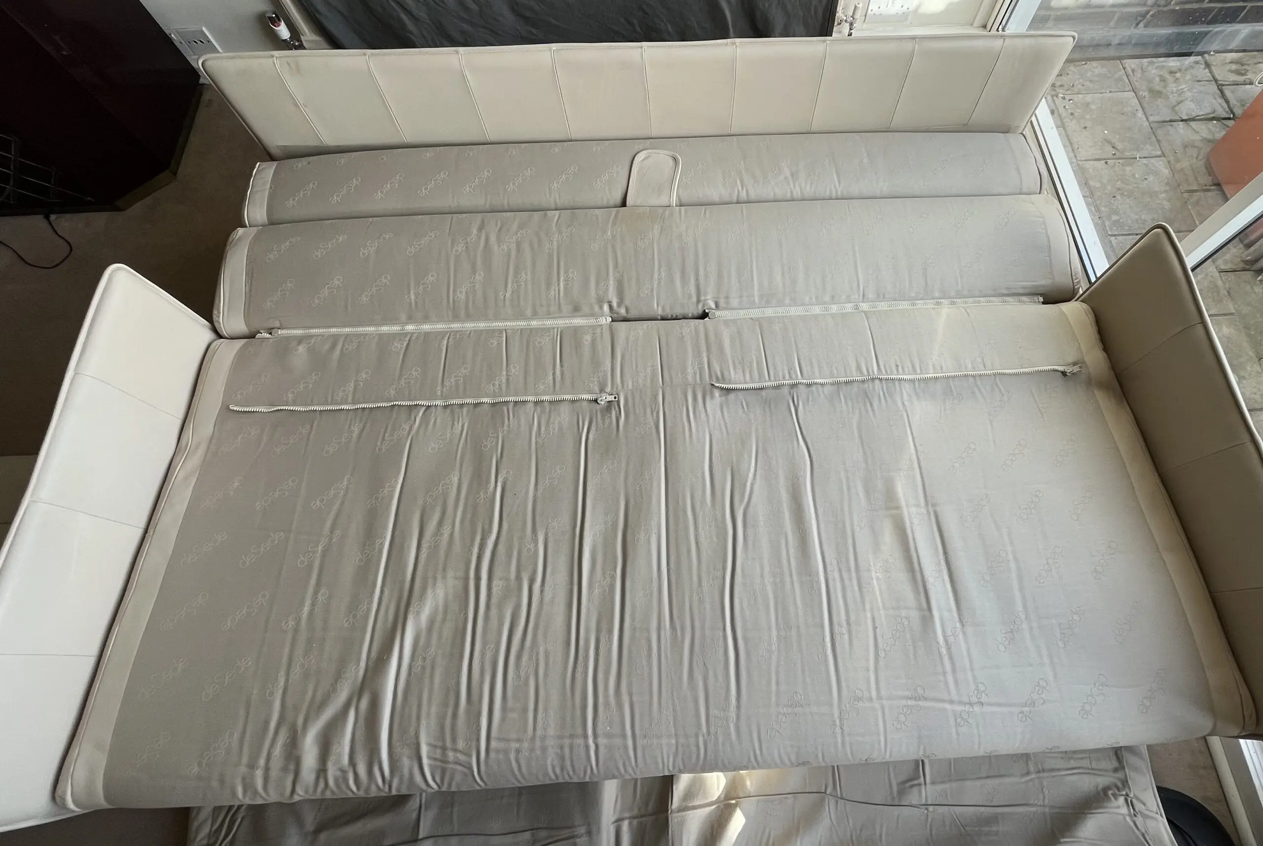 3 seater sofa bed in cream/ivory leather