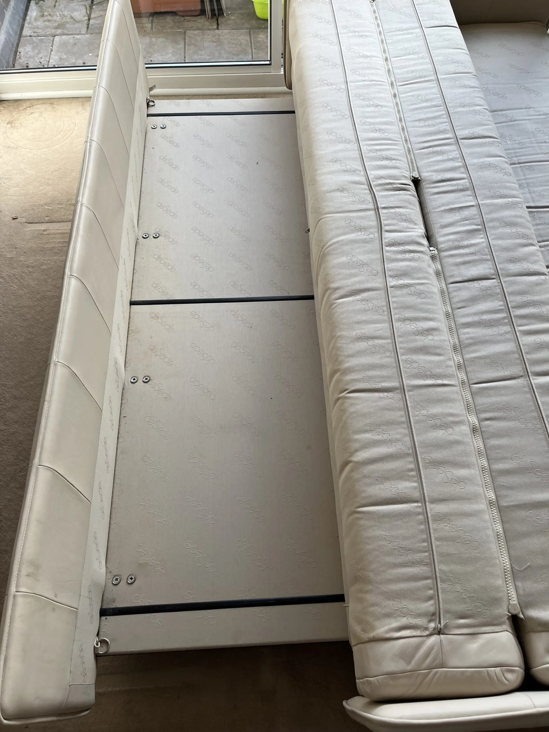 3 seater sofa bed in cream/ivory leather