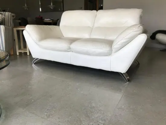 Cream 2 seater Leather Sofa with swivel chair and footstool