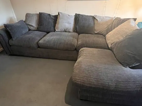 DFS charcoal corner sofa pillow back