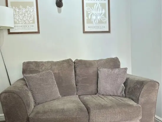 DFS 2 seater brown sofa