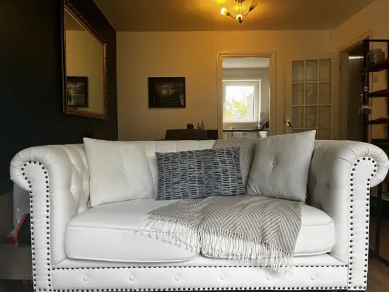 2 Seater Cream Fabric Chesterfield sofa