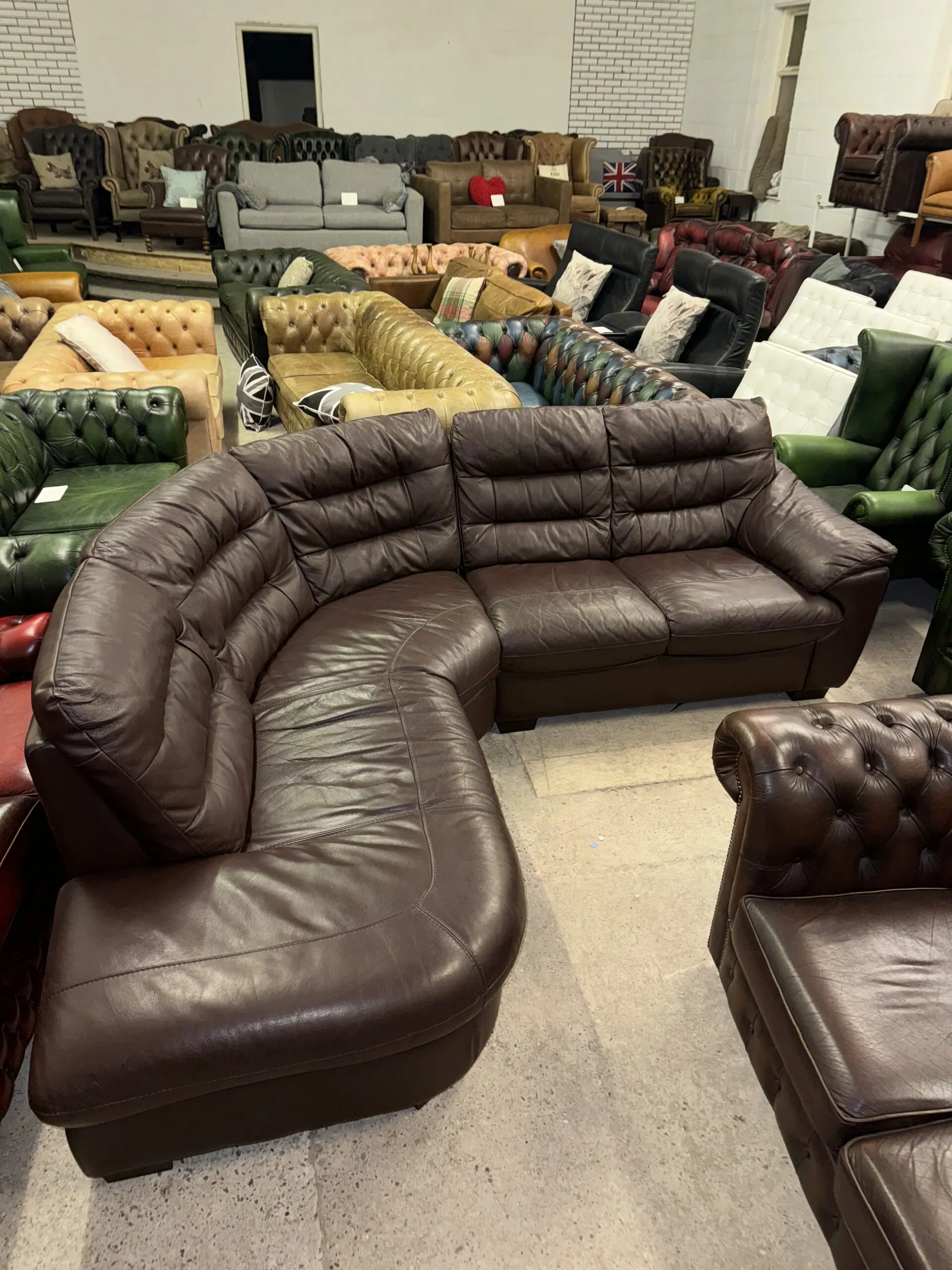 DFS Brown real leather corner sofa in 2 sections