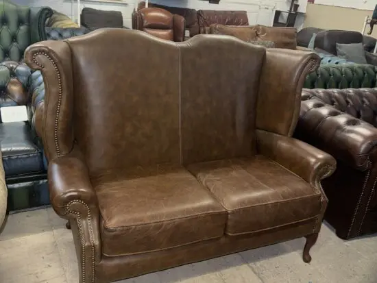 Chesterfield style brown real leather wingback two seater sofa