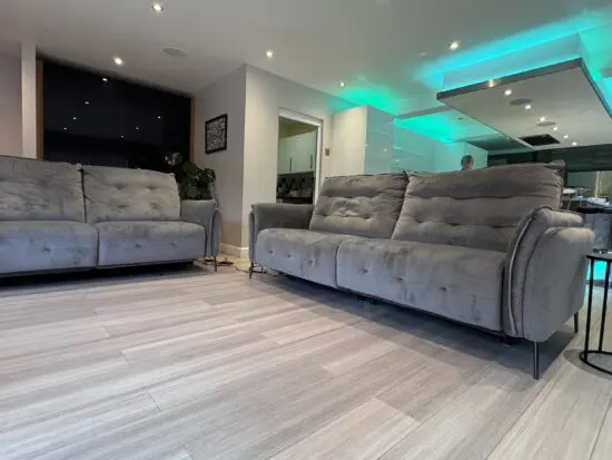 Two Large electric reclining sofas & footstool