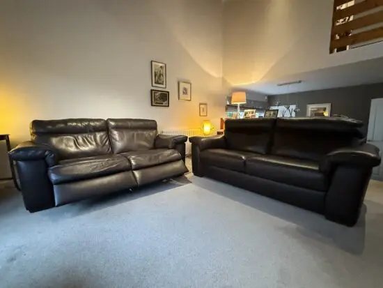2 Barker & Stonehouse dark brown leather sofas (one recliner, one standard). Very good condition from smoke and pet free home