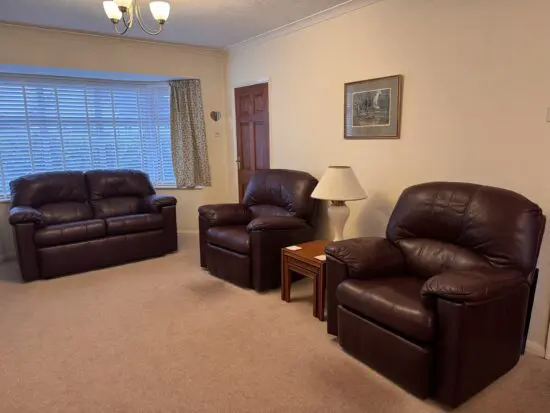 Bentalls G Plan Burgundy Sofa Set. Including one matching manual recliner.