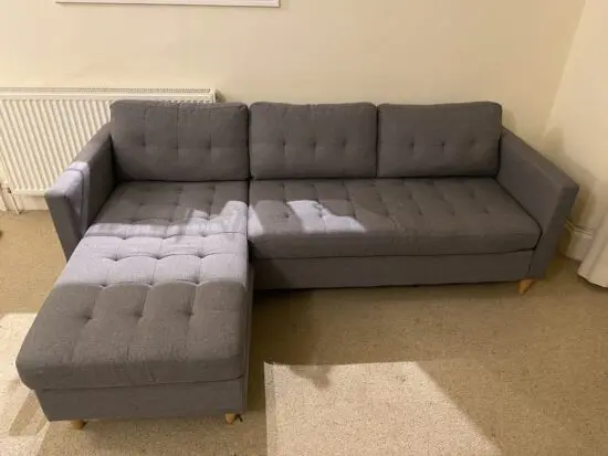 Falslev 3 seater grey fabric sofa with chaise longue