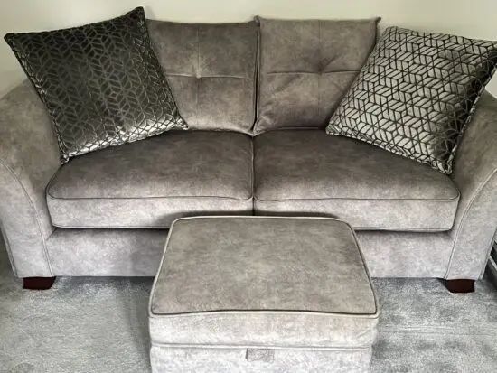 Large comfortable Furniture Village settee with storage footstool.