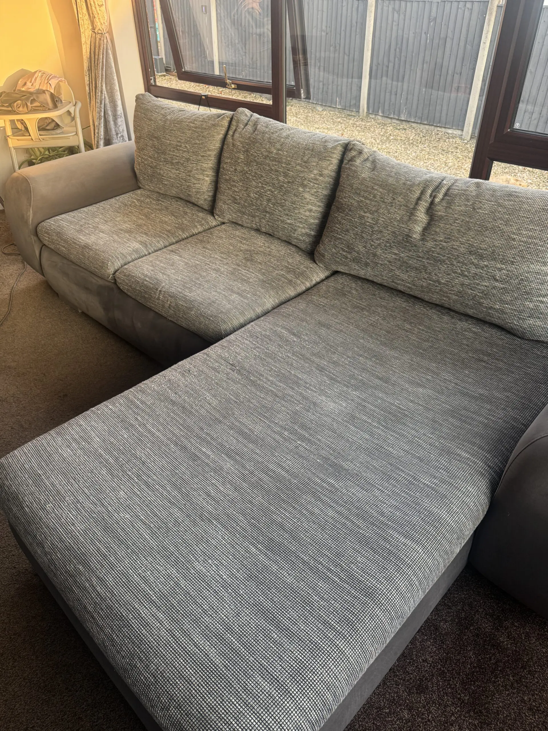 Grey corner sofa bed with storage