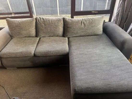 Grey corner sofa bed with storage