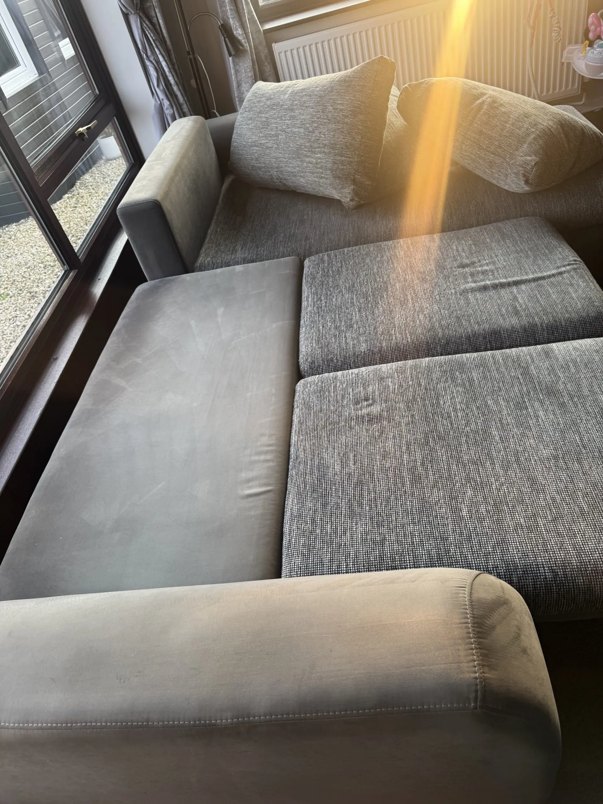 Grey corner sofa bed with storage