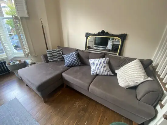 Grey L shaped sofa-bed