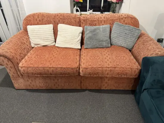 Rich orange sofa with wheels