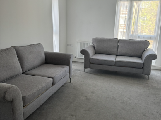 Grey high back 2 seater sofas