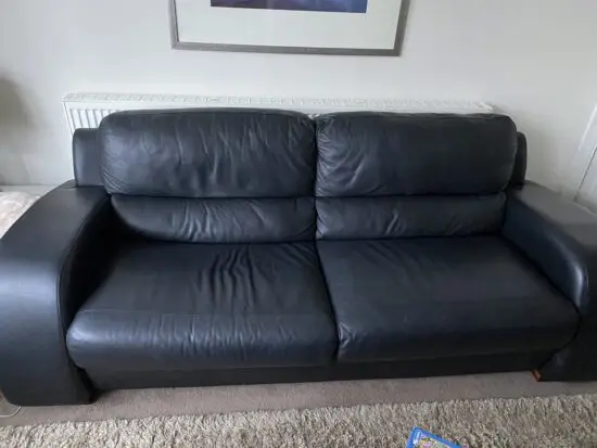 Black leather sofas in excellent condition
