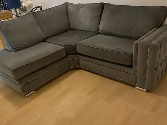 Beautiful light grey velvet corner unit with silver feet and studs