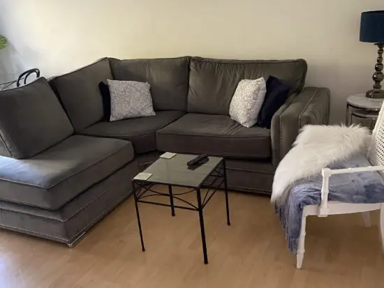 Beautiful light grey velvet corner unit with silver feet and studs