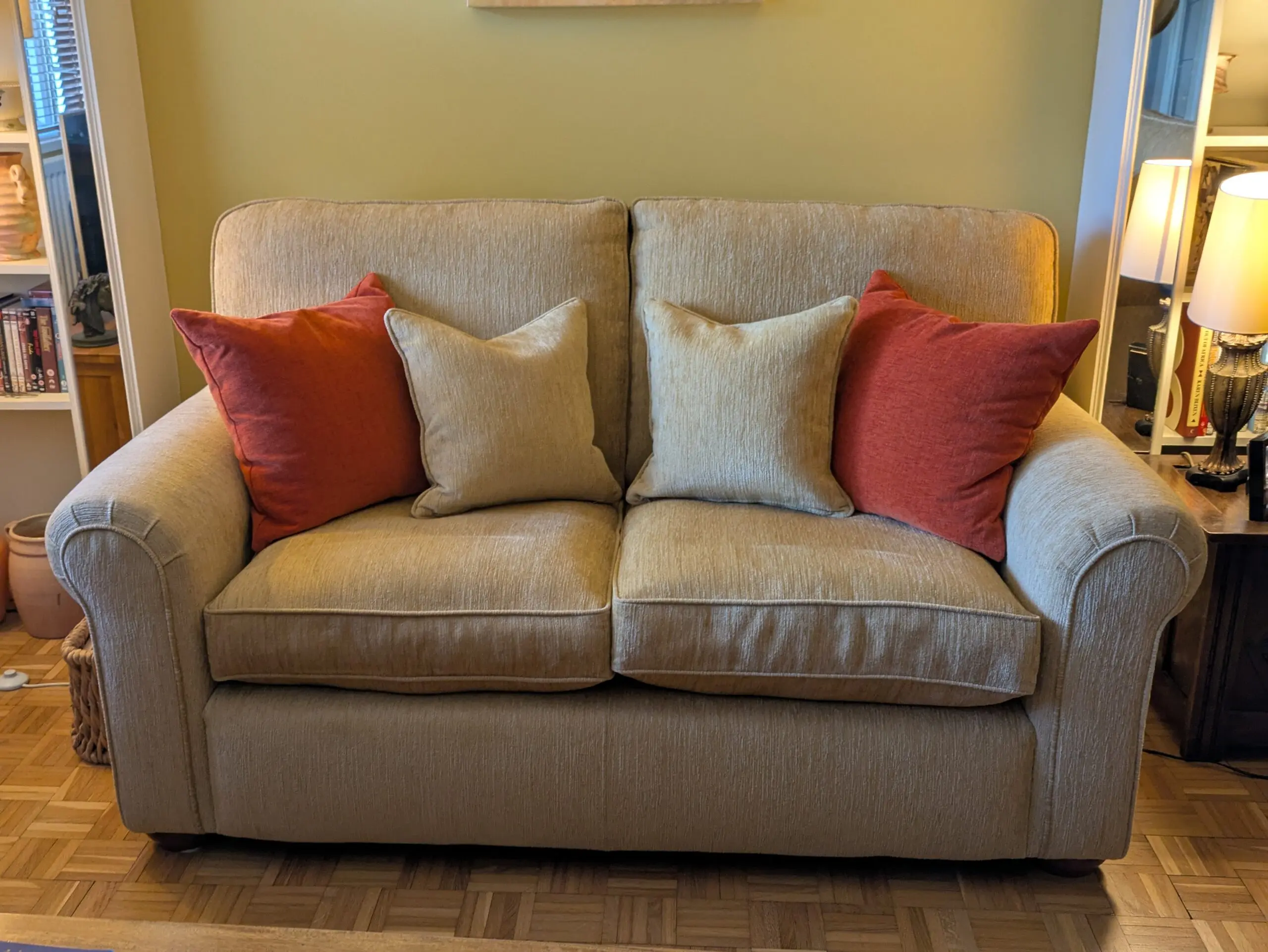 Two identical Parker Knoll sofas in soft gold chenille fabric.
