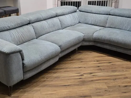 Left hand corner sofa in Teal, 4 seater with battery powered recliner plus footstool in same colour / fabric