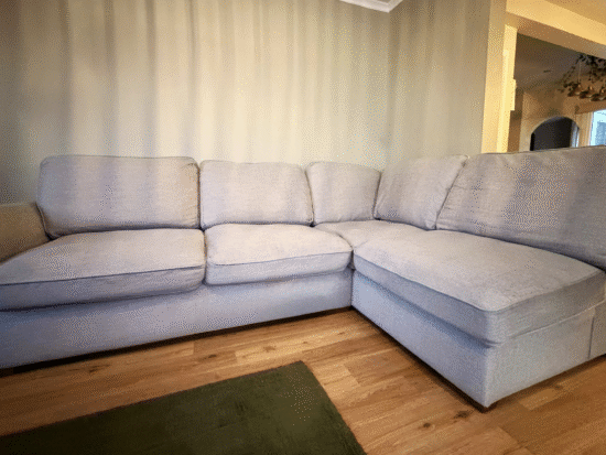 Light grey Furniture Village corner sofa with matching footstool
