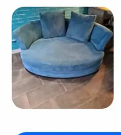 Large blue cuddle chair in cord from DFS