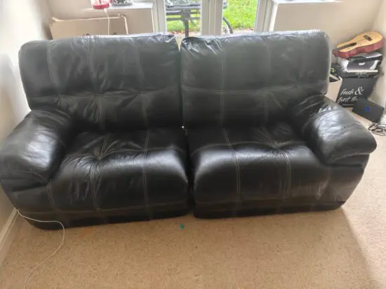 Black Recliner - Comfy with modest white Stitching.