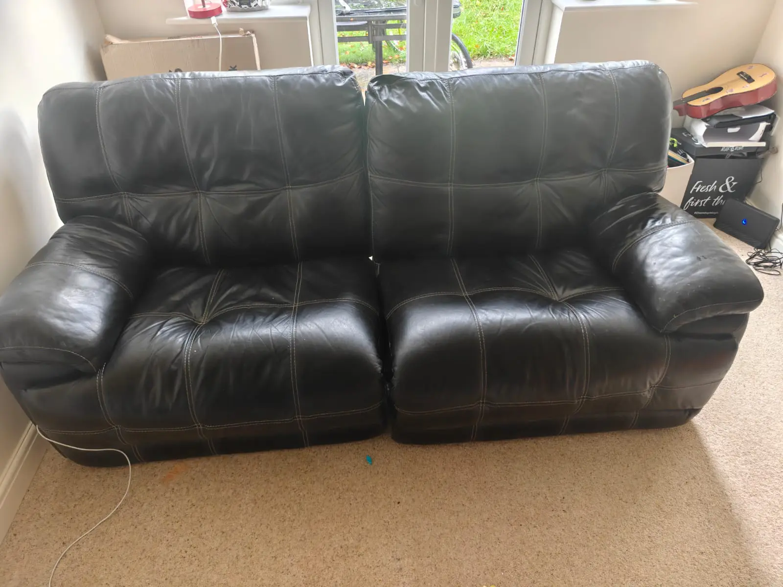 Black Recliner - Comfy with modest white Stitching.