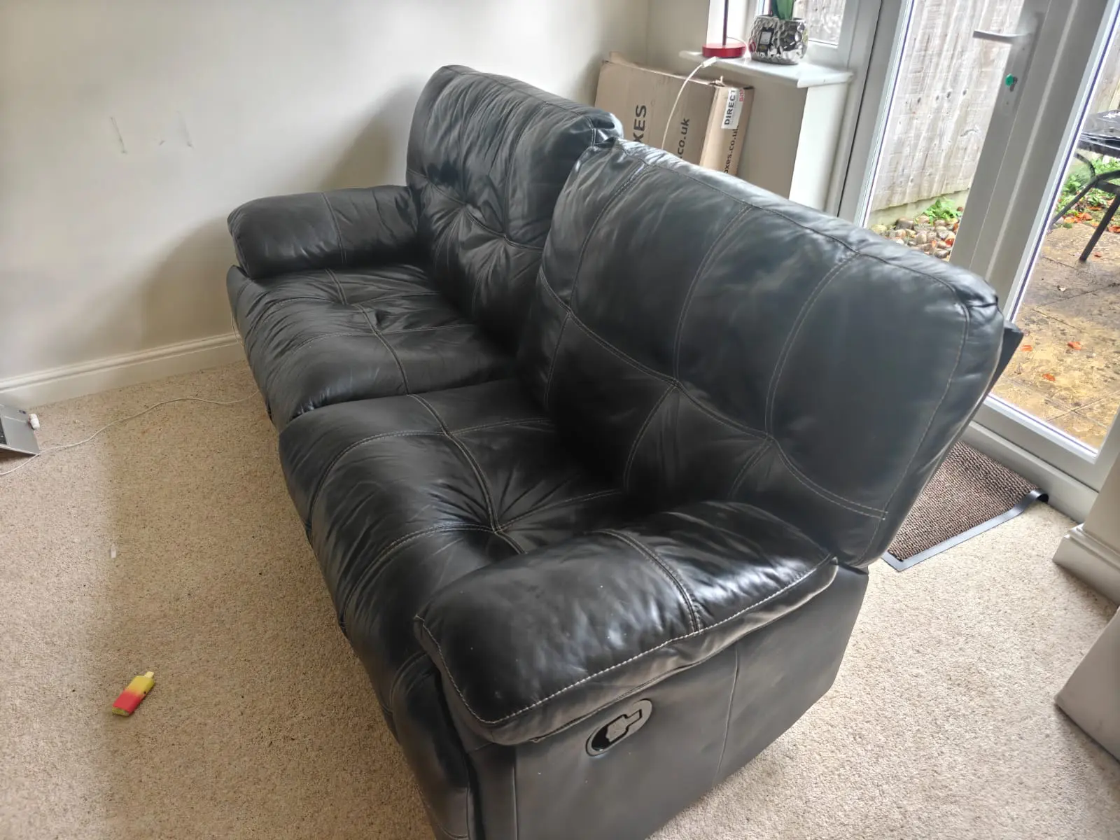 Black Recliner - Comfy with modest white Stitching.