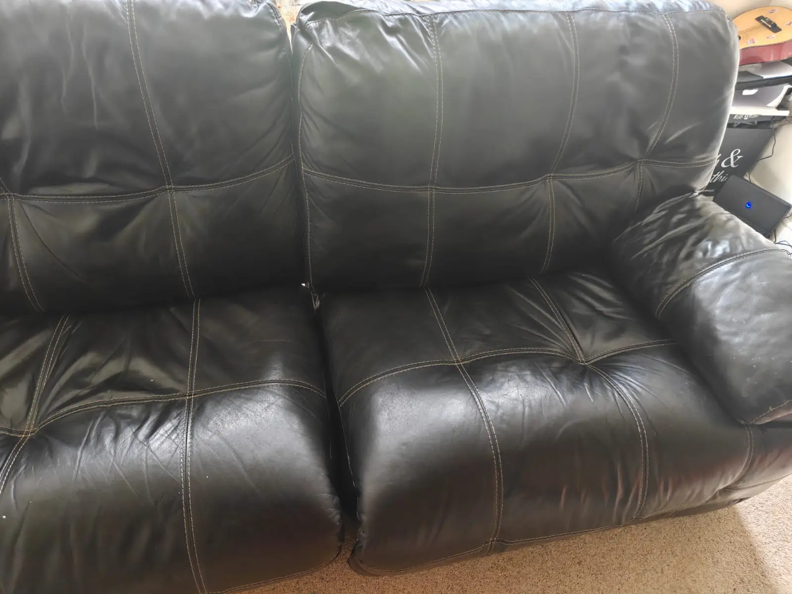 Black Recliner - Comfy with modest white Stitching.