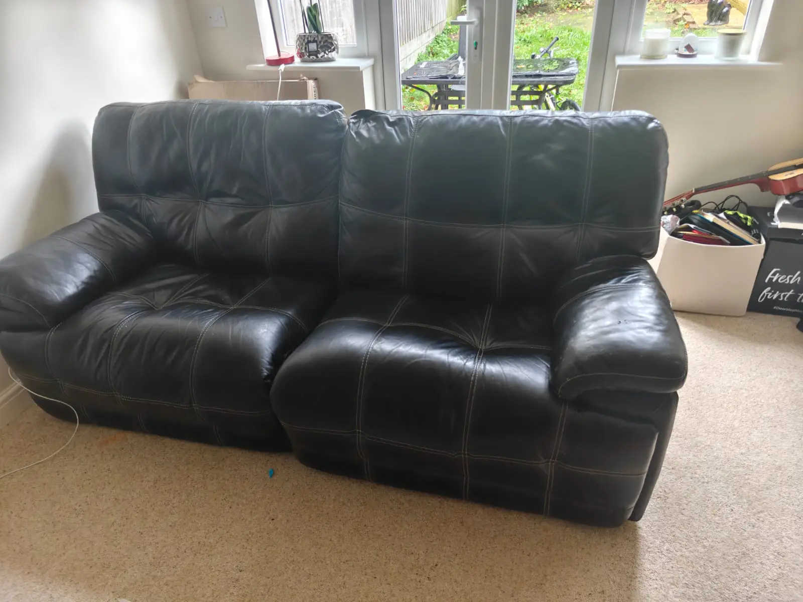 Black Recliner - Comfy with modest white Stitching.