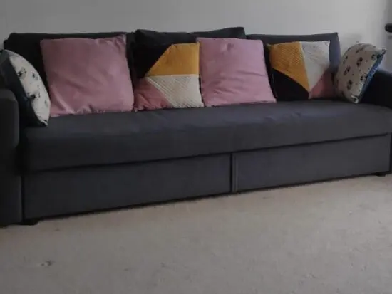 Ikea three seater sofa cum bed with big storage.