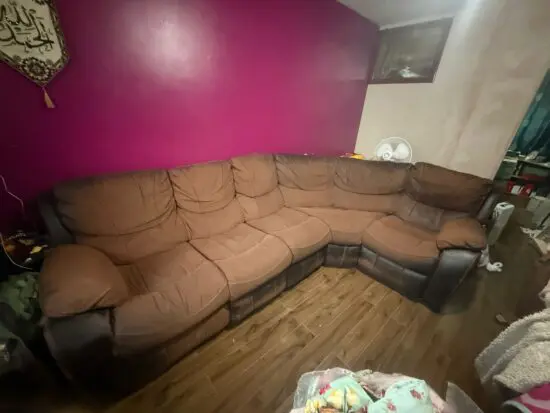 DFS corner sofa in brown and leg rest