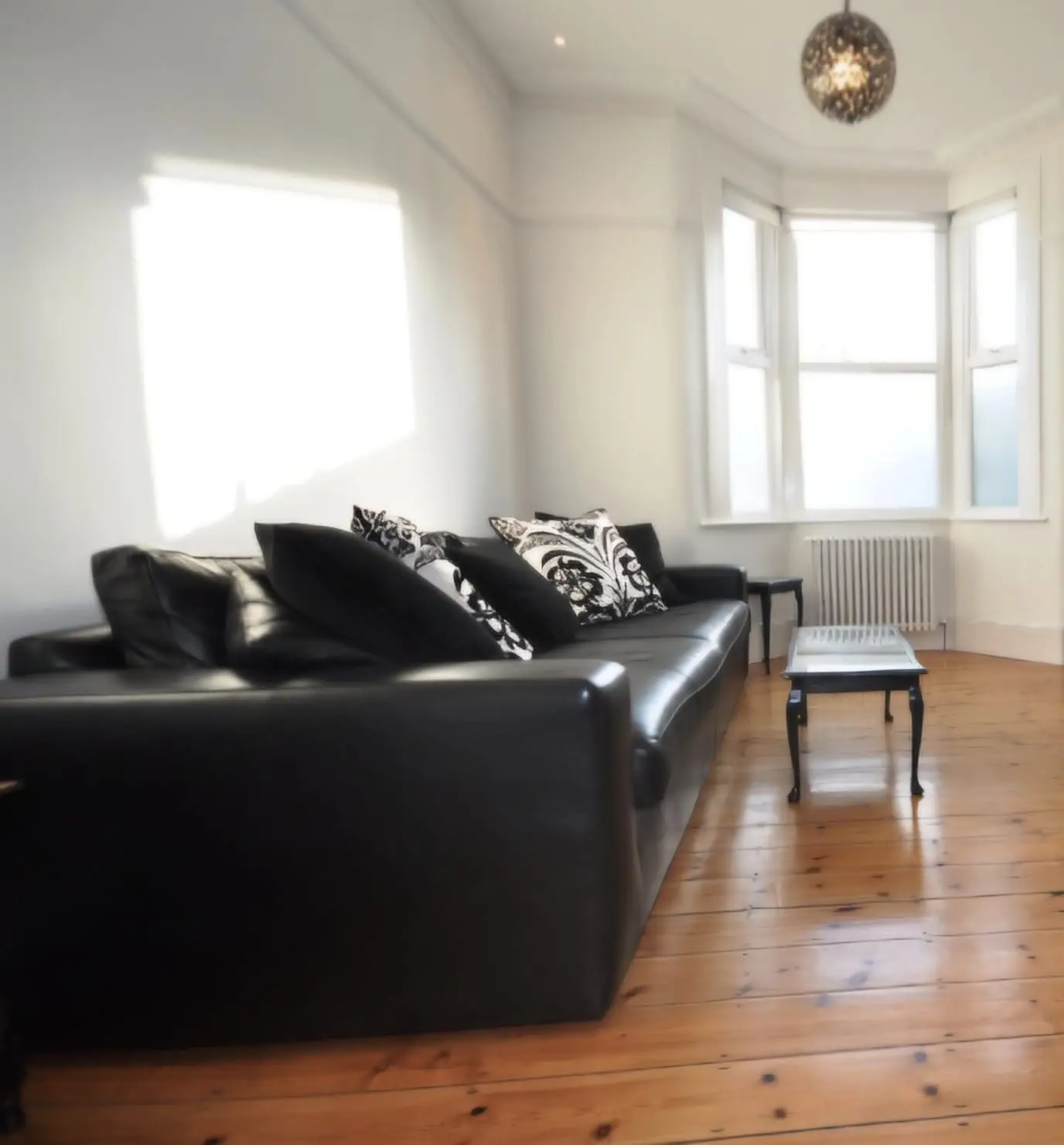 Extra Large Bespoke Black Leather Sofa with cushions