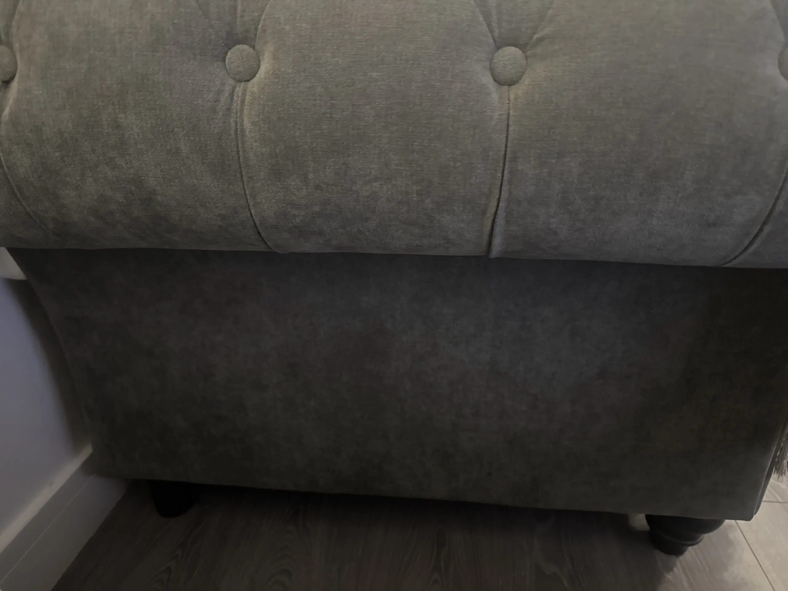 Large grey 4 seater tufted sofa and foot stool