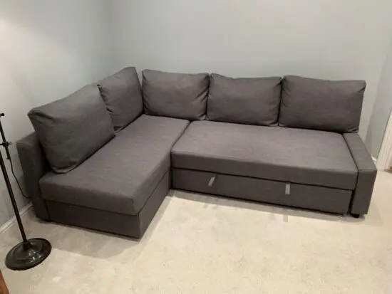 Ikea Friheten dark grey corner sofa bed with storage