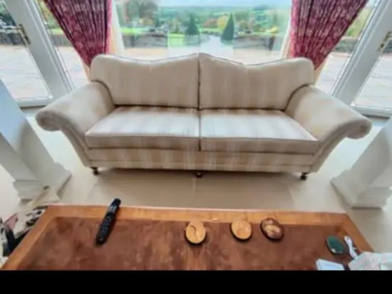 Large Wade striped ivory settee in excellent conditioniped ivory settee in excellent condition.