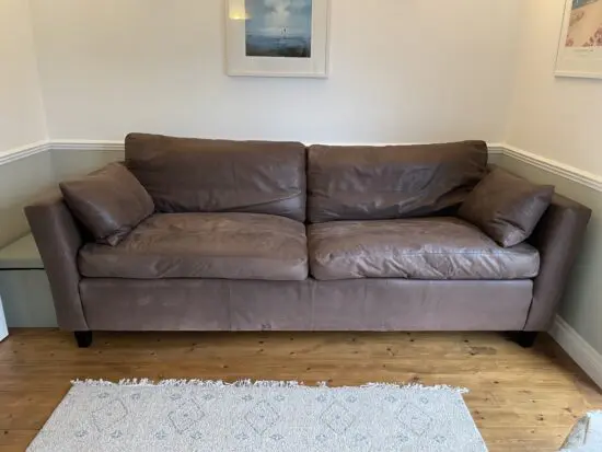 Sofa Workshop Quality real leather sofa with feather filled cushions.