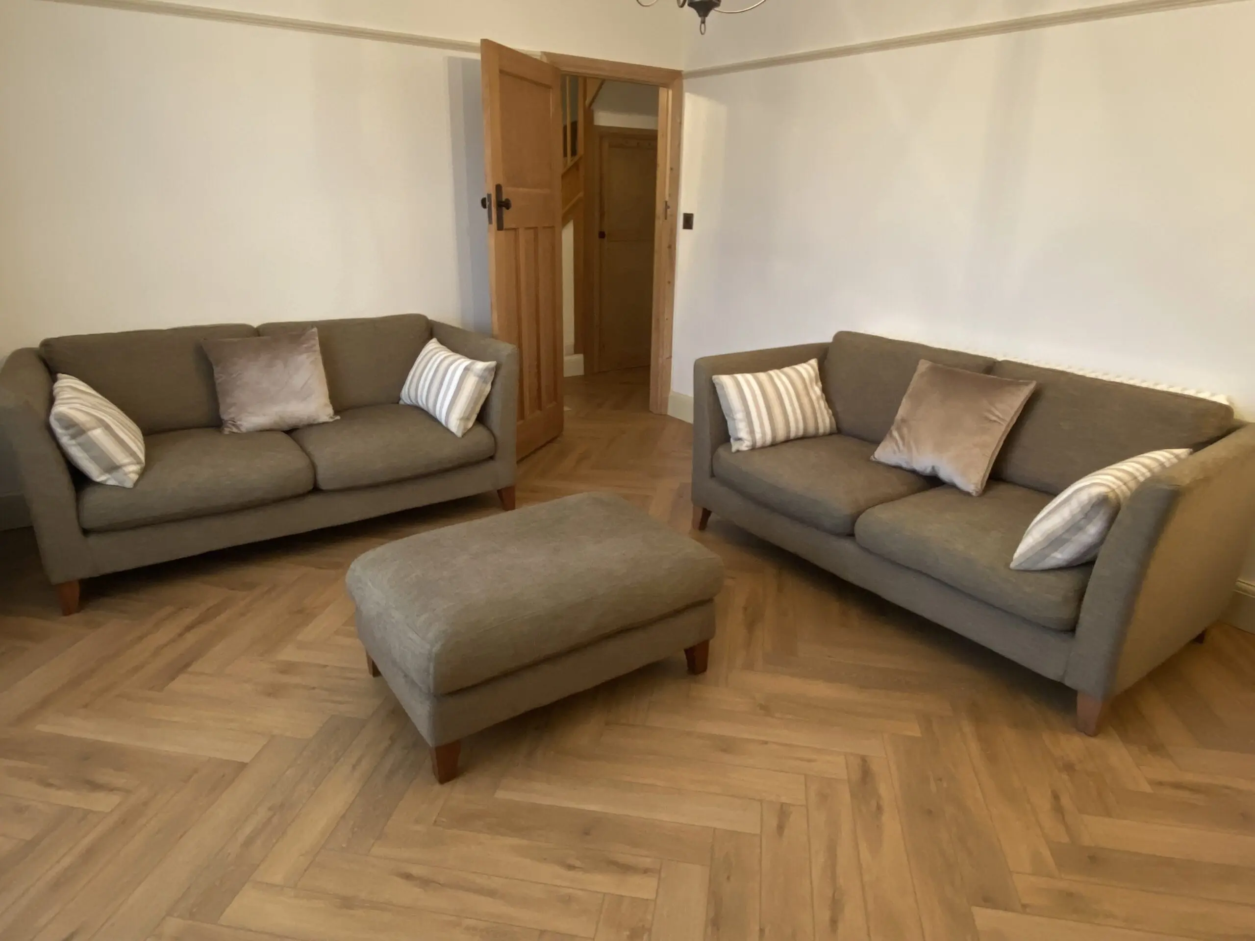 Two Large 2 Seater Sofas and Footstool By Nick Munro