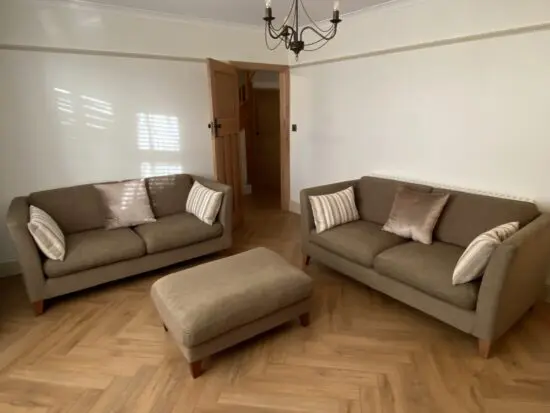 Two Large 2 Seater Sofas and Footstool By Nick Munro