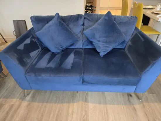 DFS 2 x blue velvet settees and silver and mustard pouffe