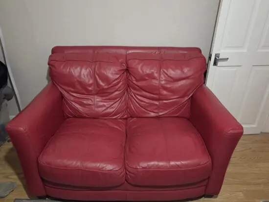 2 x Red 2 piece sofa with footstool