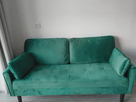 Green 2 seater sofa, bought from the range