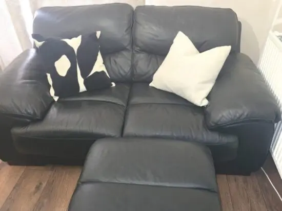 DFS Dazzle Black Leather Sofa Set (Two x 2-Seater Sofas and Footstool)