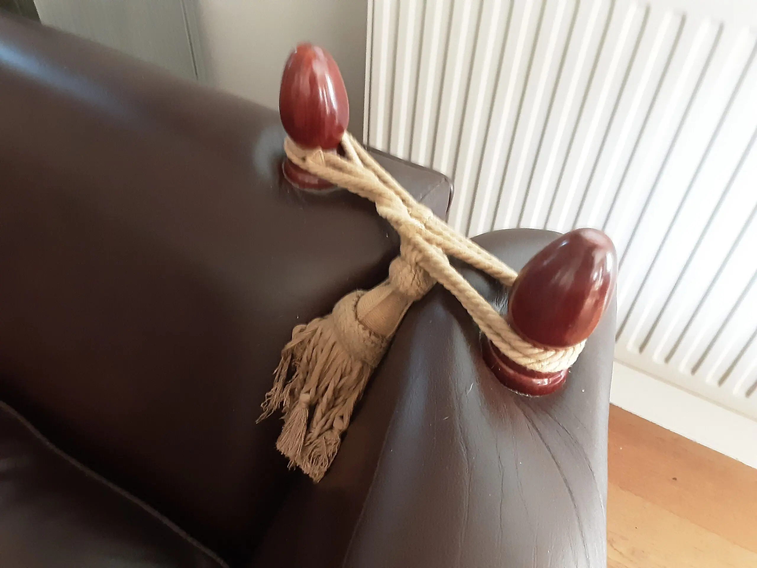 A PAIR OF LARGE LAURA ASHLEY LEATHER SOFAS in BROWN