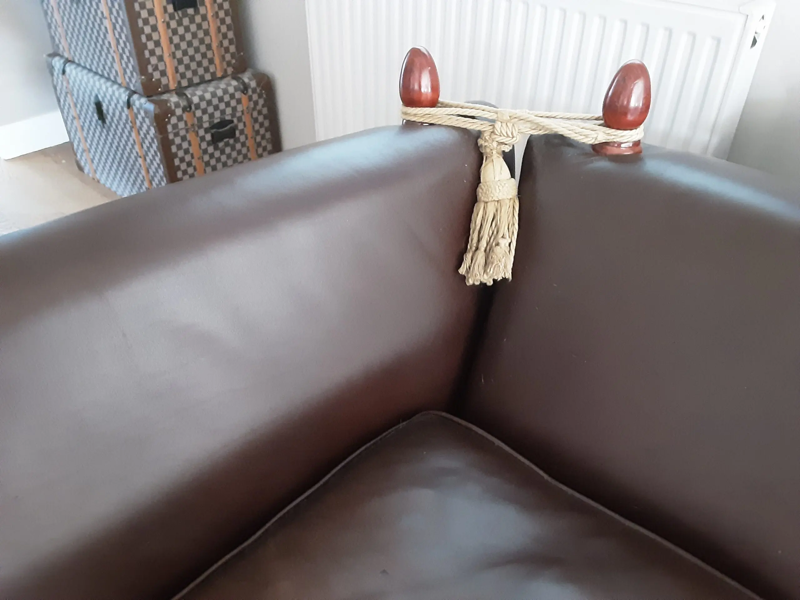 A PAIR OF LARGE LAURA ASHLEY LEATHER SOFAS in BROWN