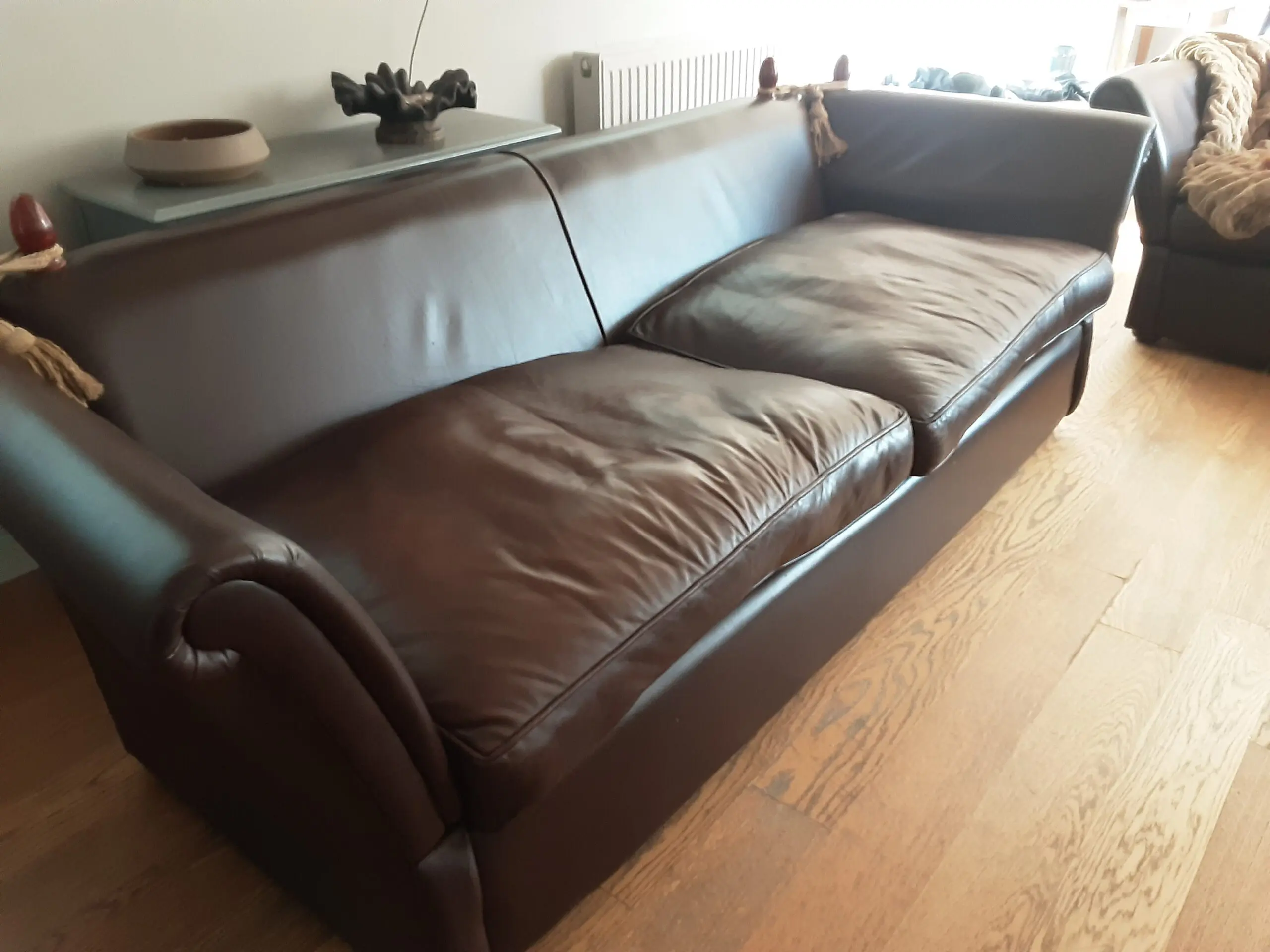 A PAIR OF LARGE LAURA ASHLEY LEATHER SOFAS in BROWN