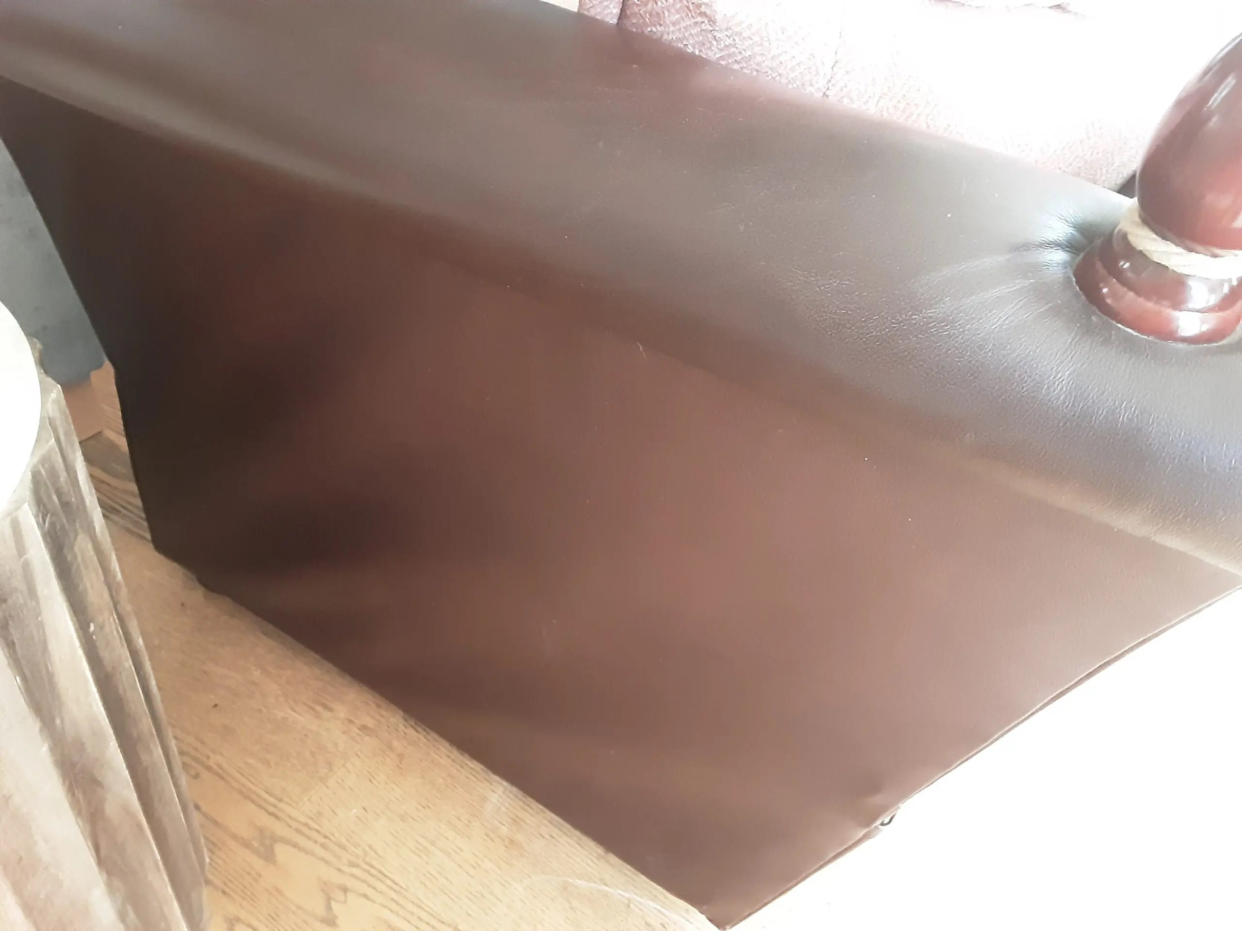 A PAIR OF LARGE LAURA ASHLEY LEATHER SOFAS in BROWN