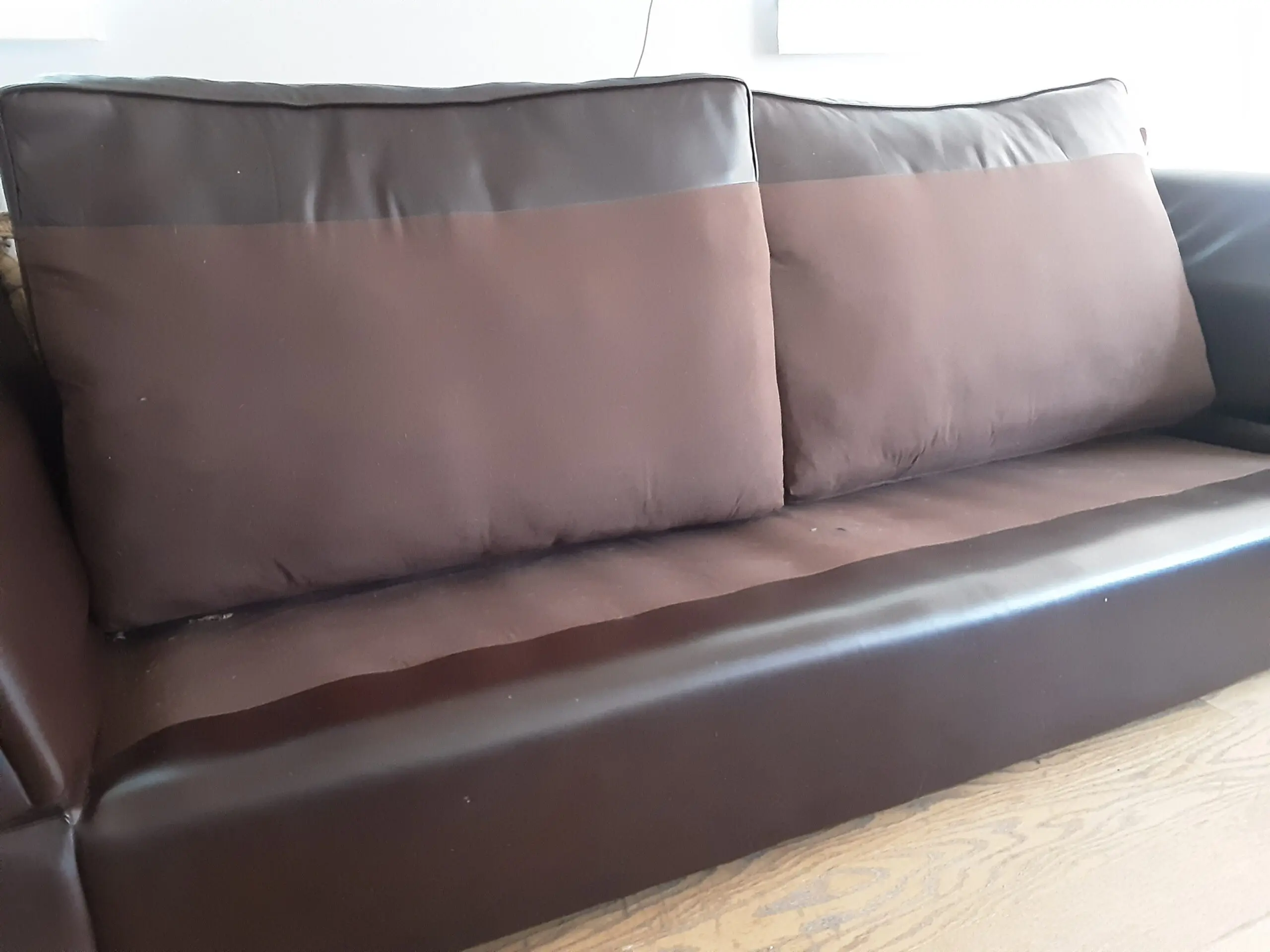 A PAIR OF LARGE LAURA ASHLEY LEATHER SOFAS in BROWN
